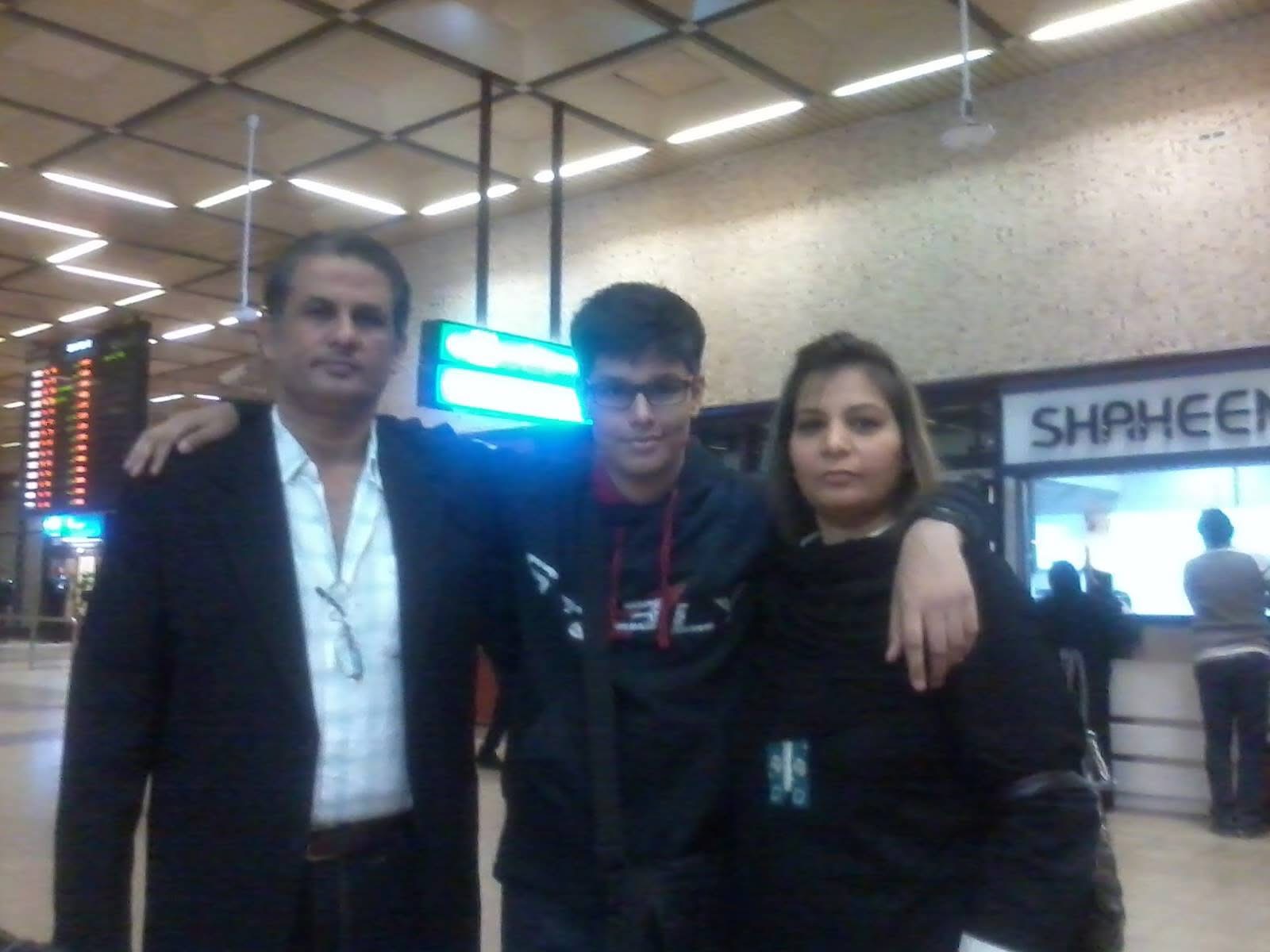 Fardan with his parents at Karachi airport, before leaving for the United States.